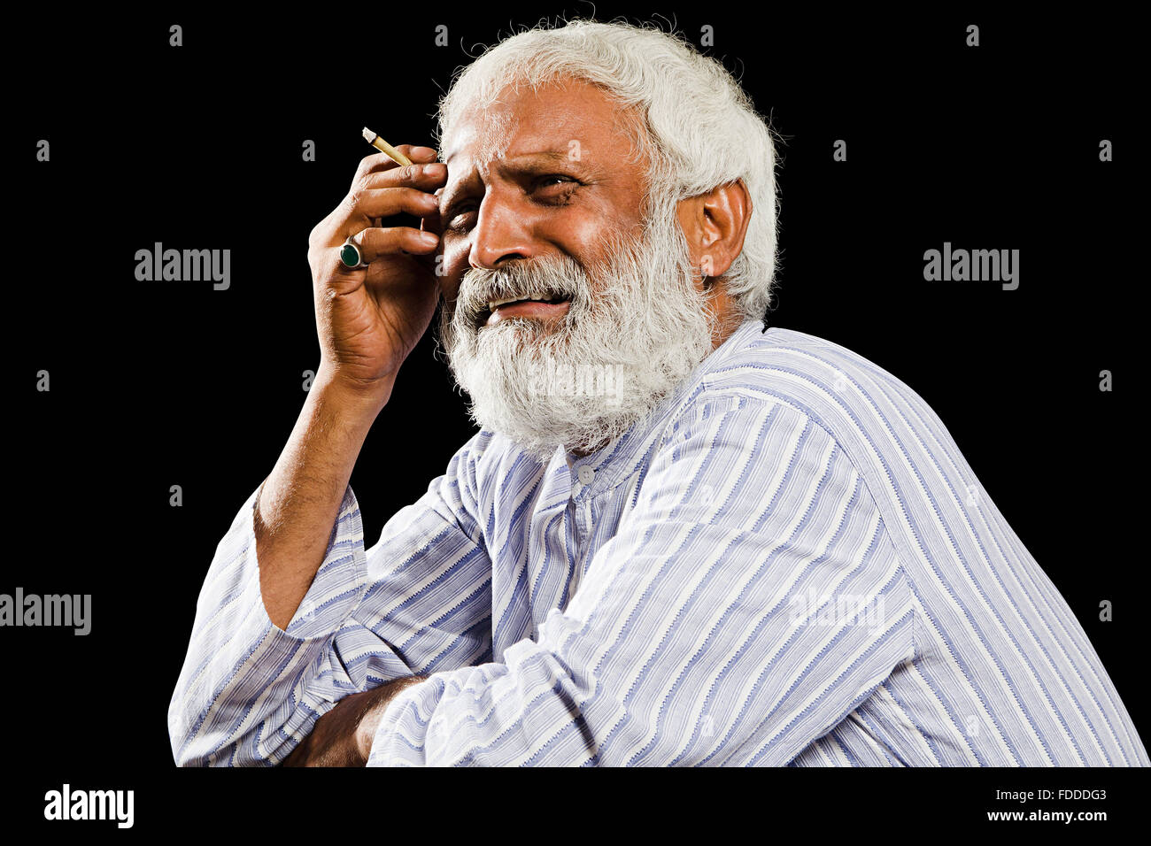 1 indian Senior Adult Man Villager Sitting Smoking Bidi Crying Stock Photo