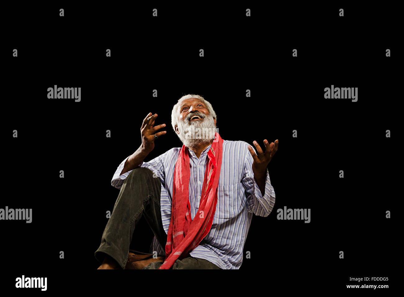 1 indian Senior Adult Man Villager Sitting Smoking Bidi Looking Up Excitement Stock Photo