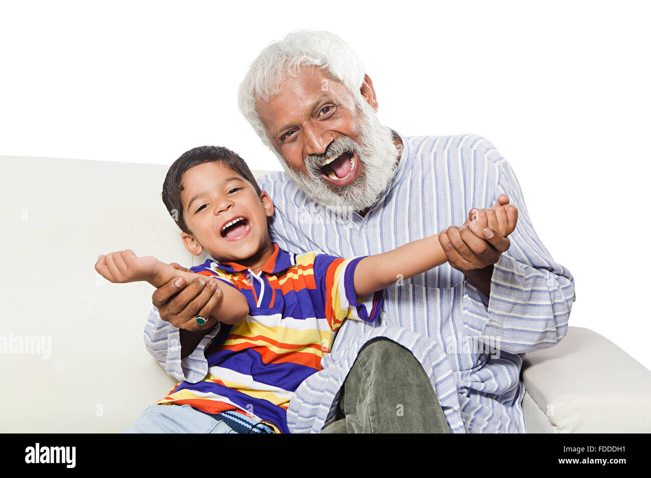 2 People GrandFather and Grandson sitting sofa Shouting fun Stock Photo