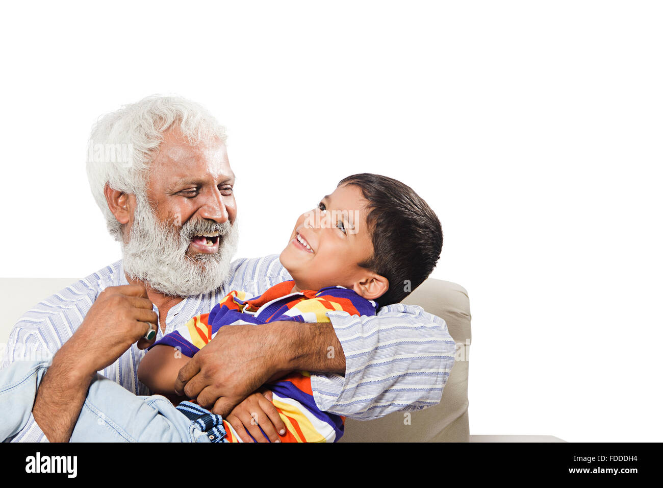 2 People GrandFather and Grandson sitting sofa fun Stock Photo