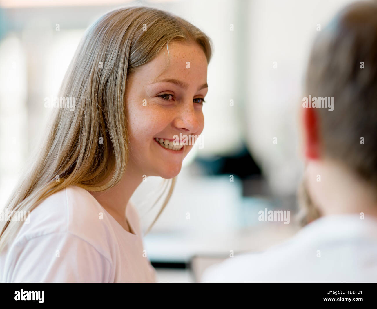 Portrait of a happy girl indoors Stock Photo - Alamy