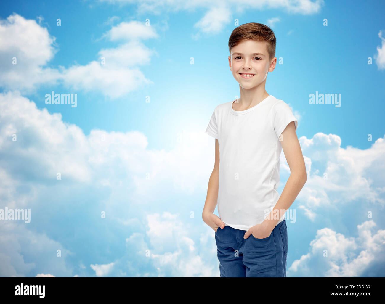 happy boy in white tshirt and jeans Stock Photo Alamy