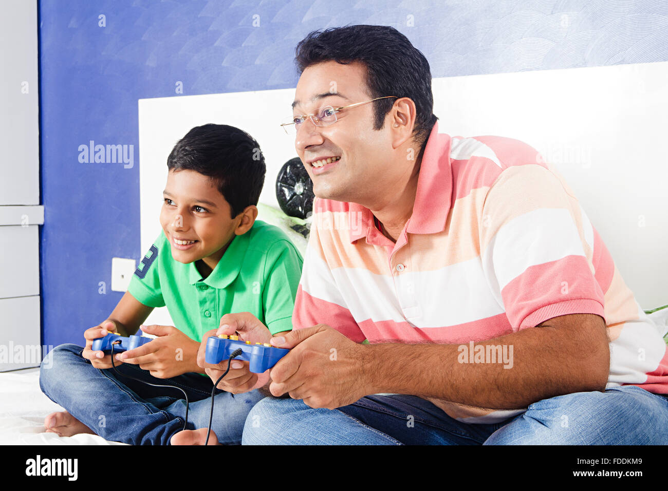2 People Father and Kid Son Sitting Bedroom Playing Video Game Stock Photo