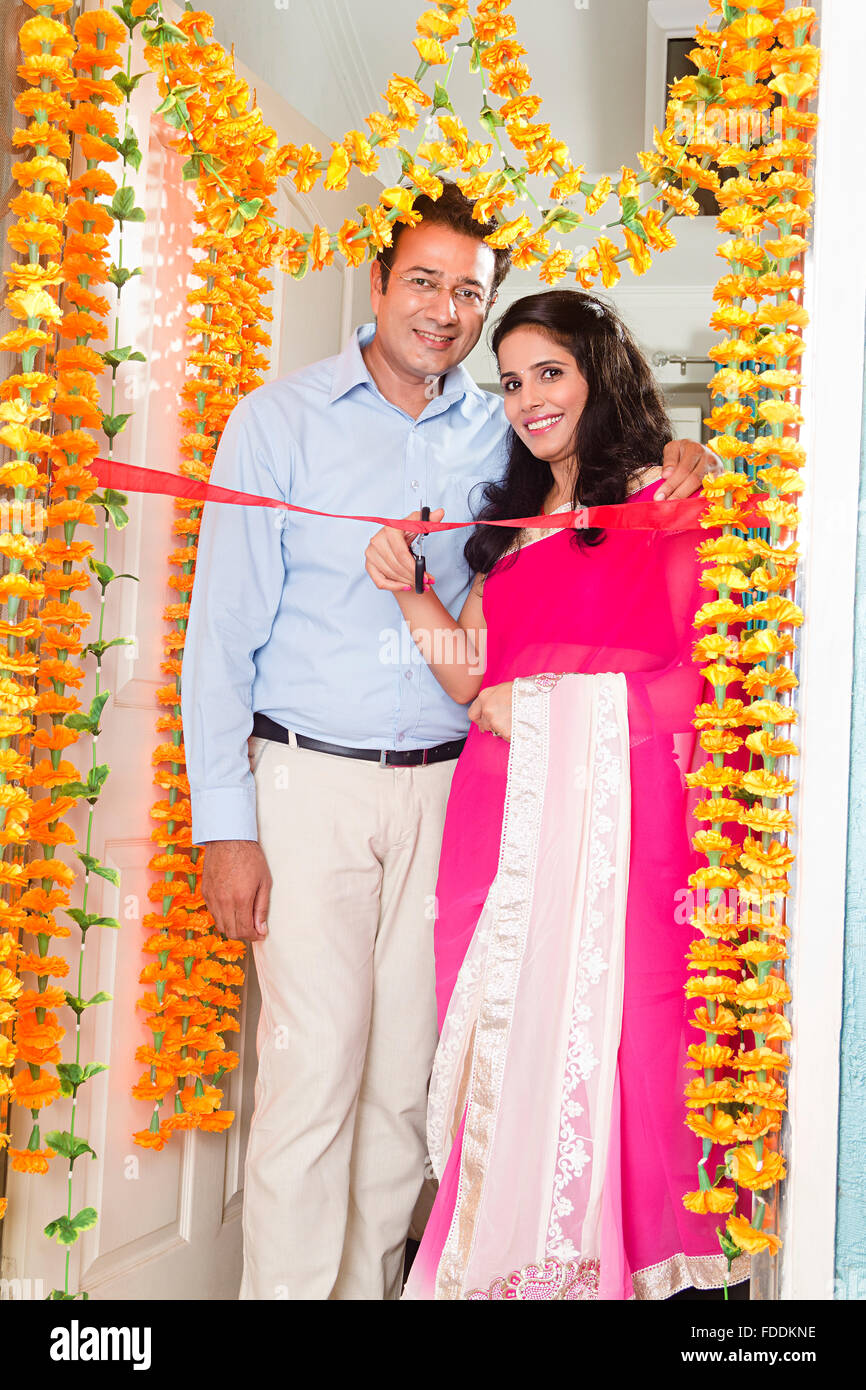 2 Married Couples Husband and wife House Grihapravesh Ribbon Cutting Stock Photo