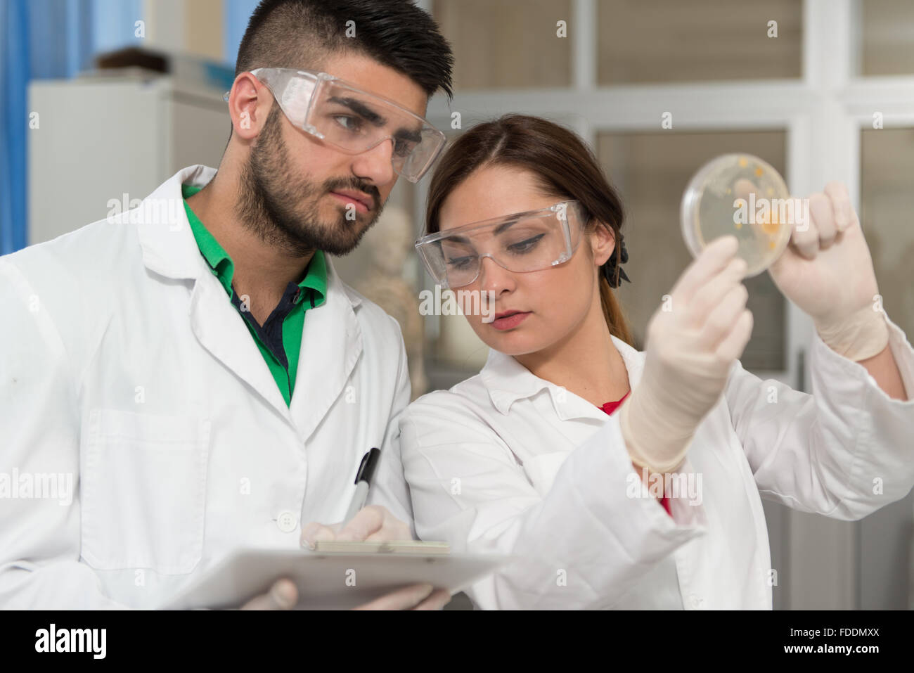 Group Of High School Students Working Together At Laboratory Class