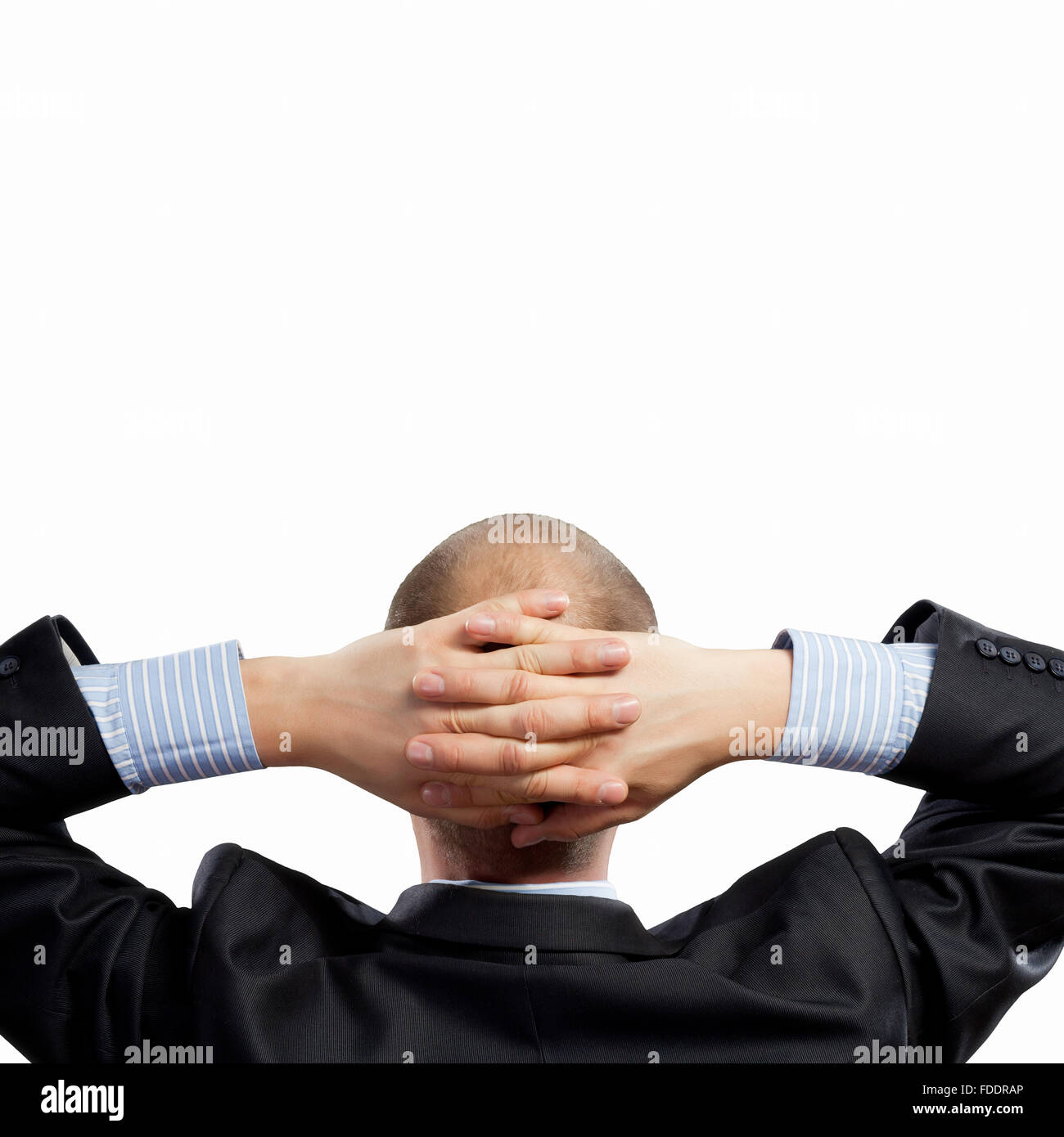 Back view image of businessman with arms crossed behind head. Place for