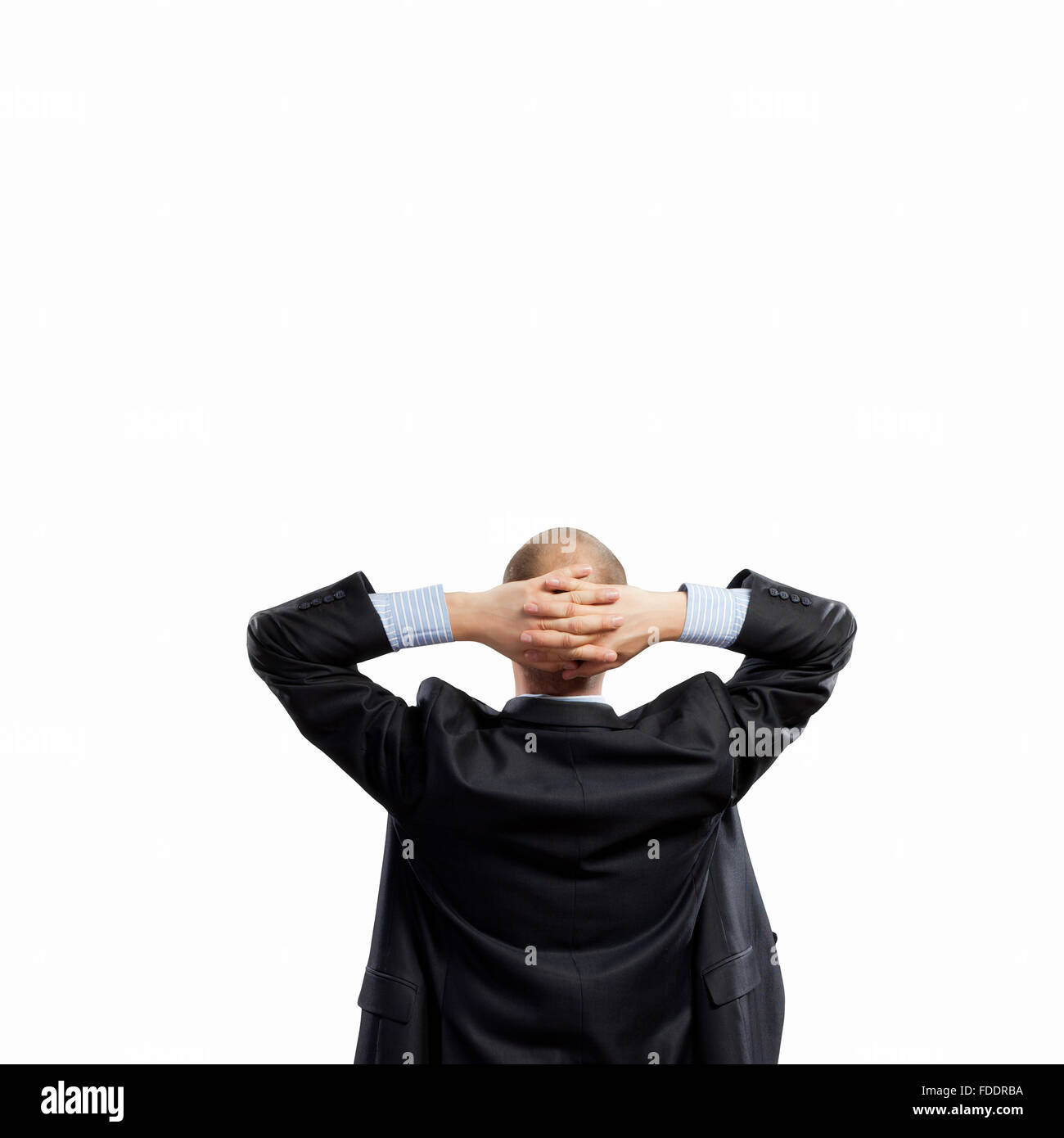 Back view image of businessman with arms crossed behind head. Place for