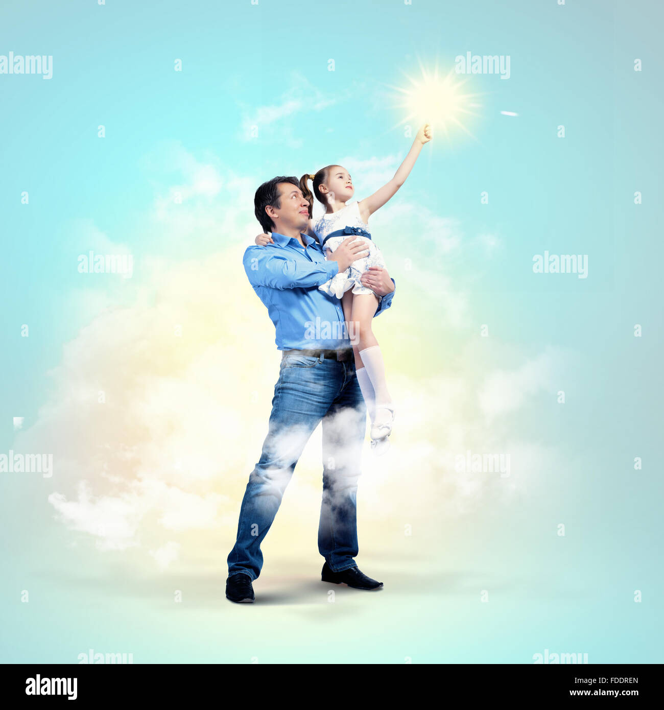Image of happy father holding on hands daughter Stock Photo - Alamy