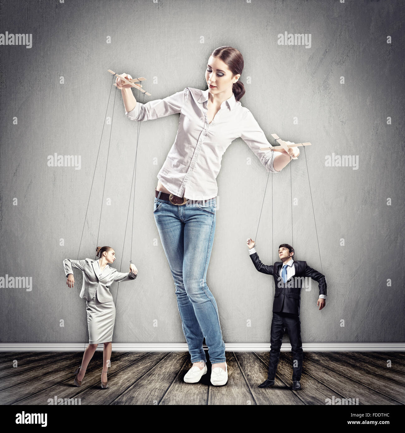 smiling female puppeteer holding male marionette isolated on grey Stock  Photo - Alamy