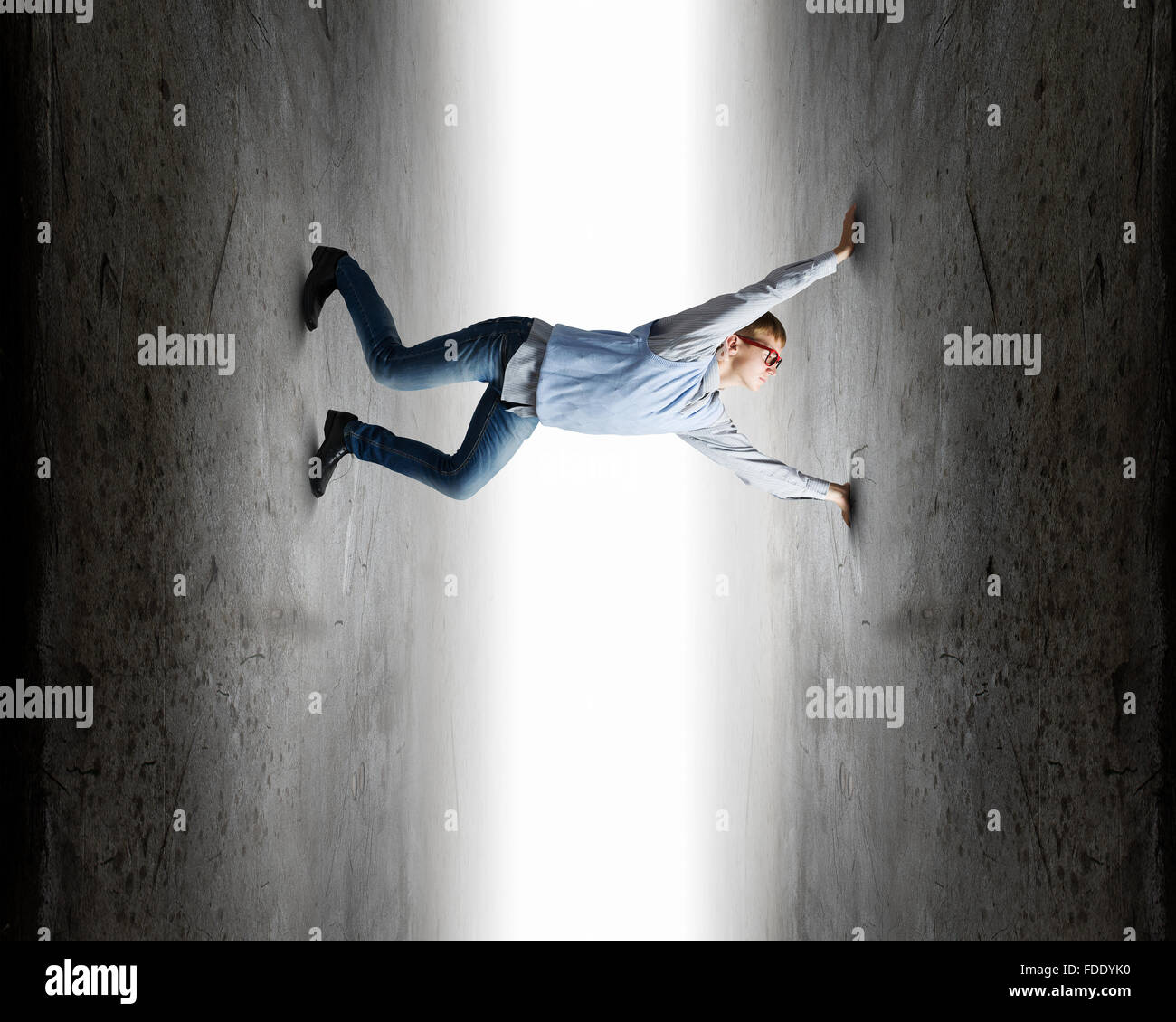Young troubled businessman trapped between two walls Stock Photo Alamy