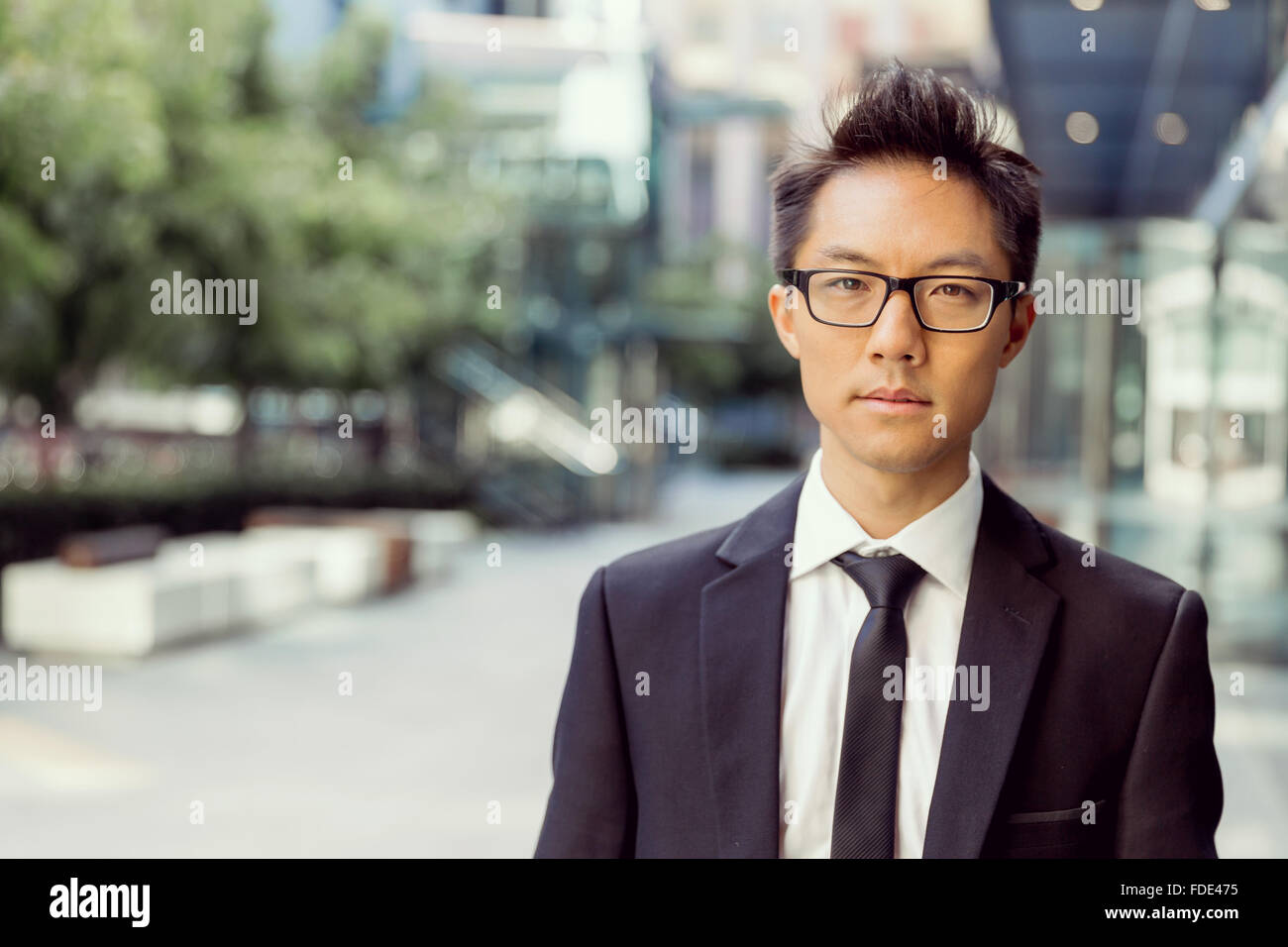 Businessman outdoors in city business district Stock Photo - Alamy