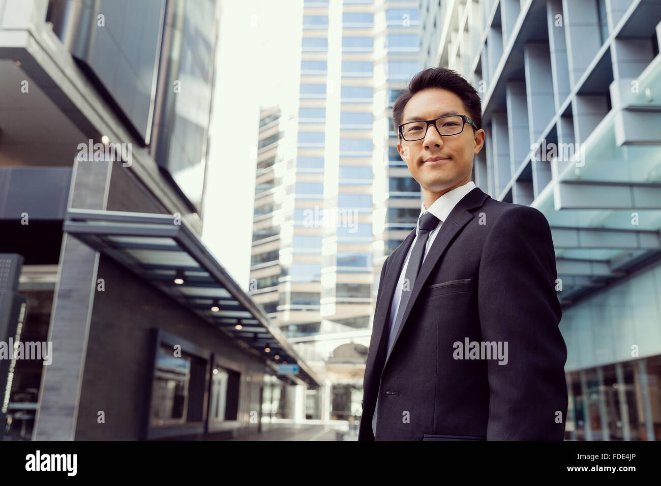 Businessman outdoors in city business district Stock Photo - Alamy