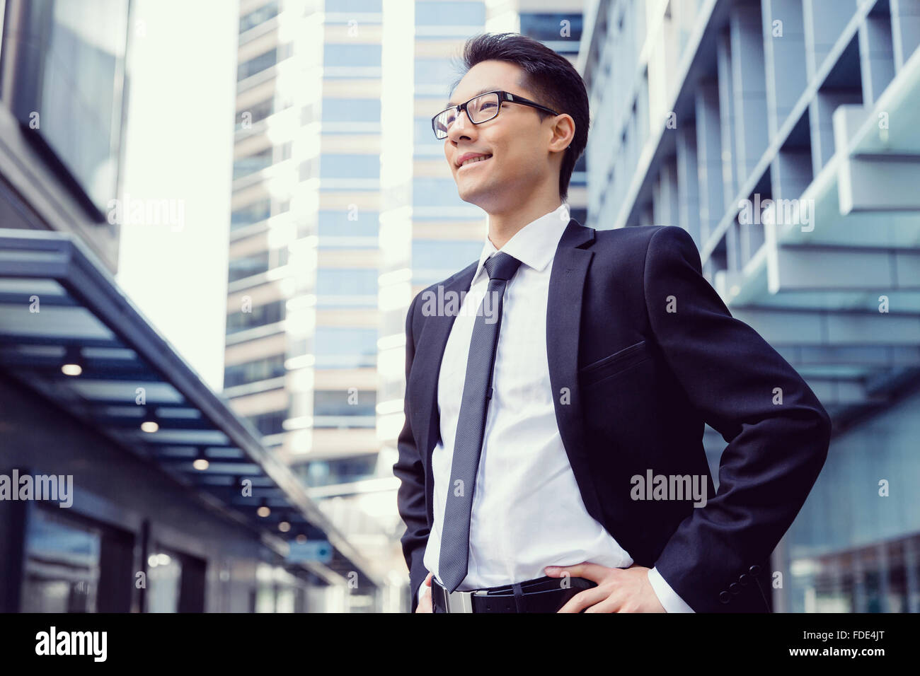Businessman standing outdoors in city business district Stock Photo - Alamy
