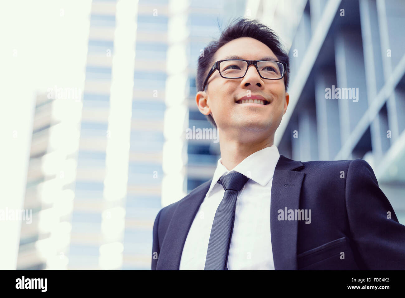 Businessman standing outdoors in city business district Stock Photo - Alamy