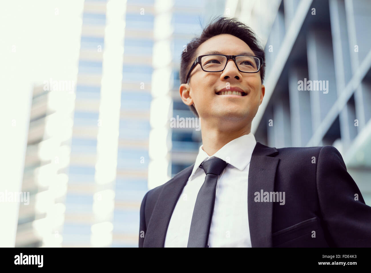 Businessman outdoors in city business district Stock Photo - Alamy