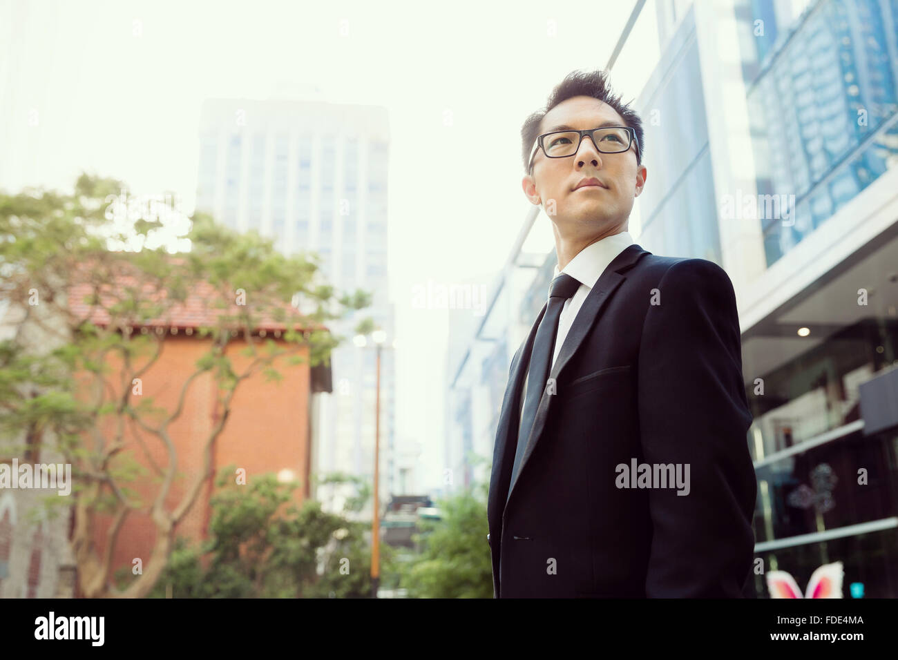 Businessman outdoors in city business district Stock Photo - Alamy