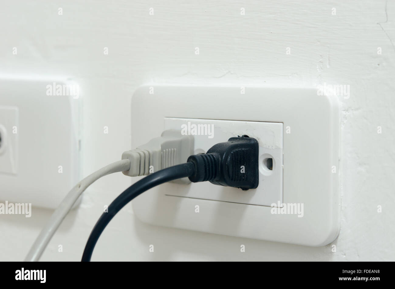 Plug power socket on the wall Stock Photo Alamy