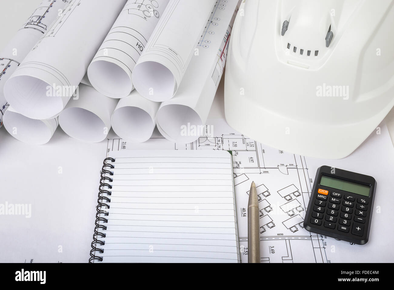 Copy book with calculator on blueprint Stock Photo Alamy