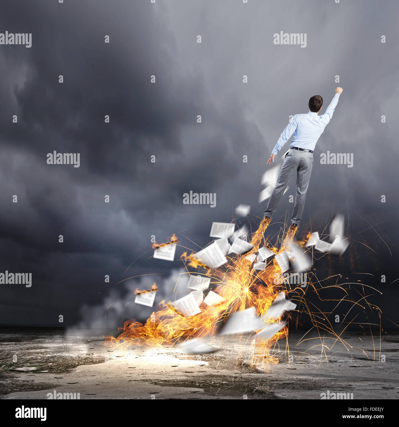 Rear view of businessman superhero flying up in sky Stock Photo - Alamy