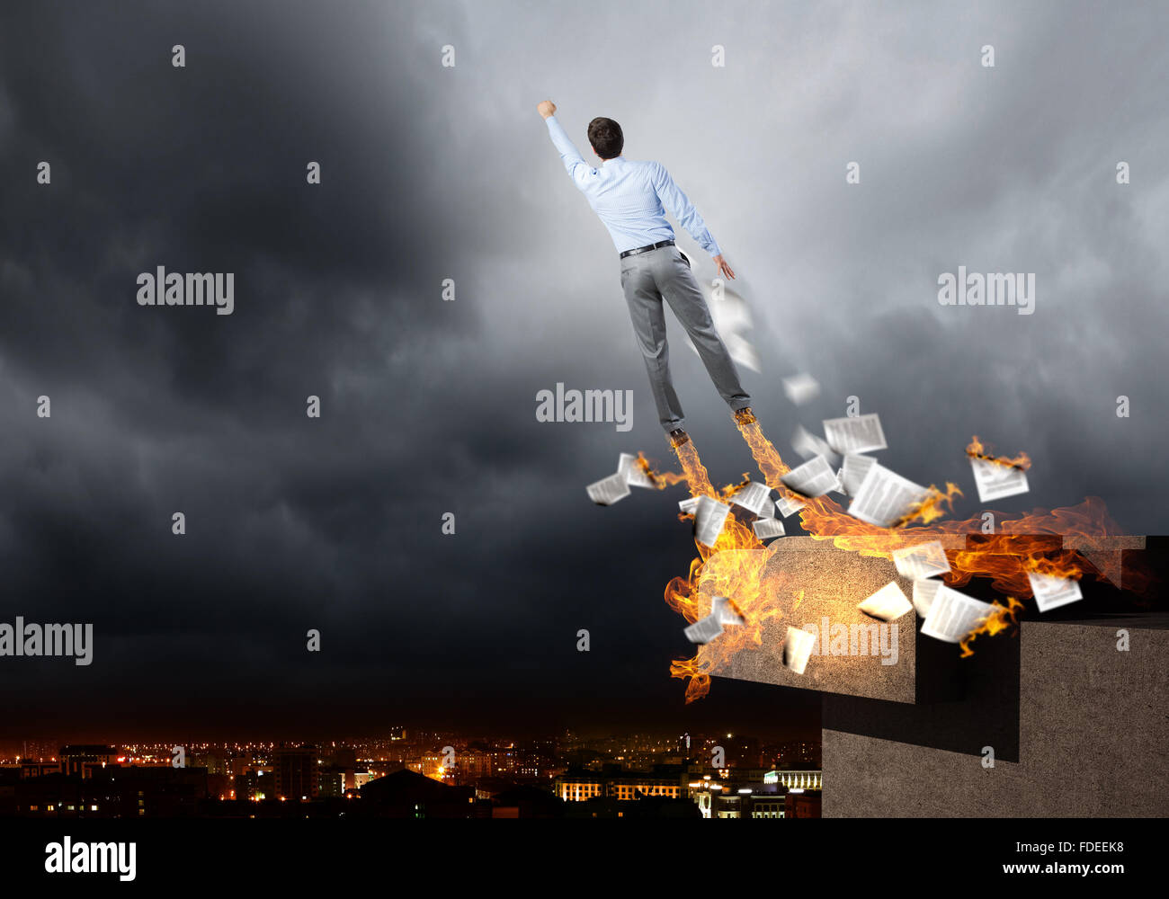 Rear view of businessman superhero flying up in sky Stock Photo - Alamy
