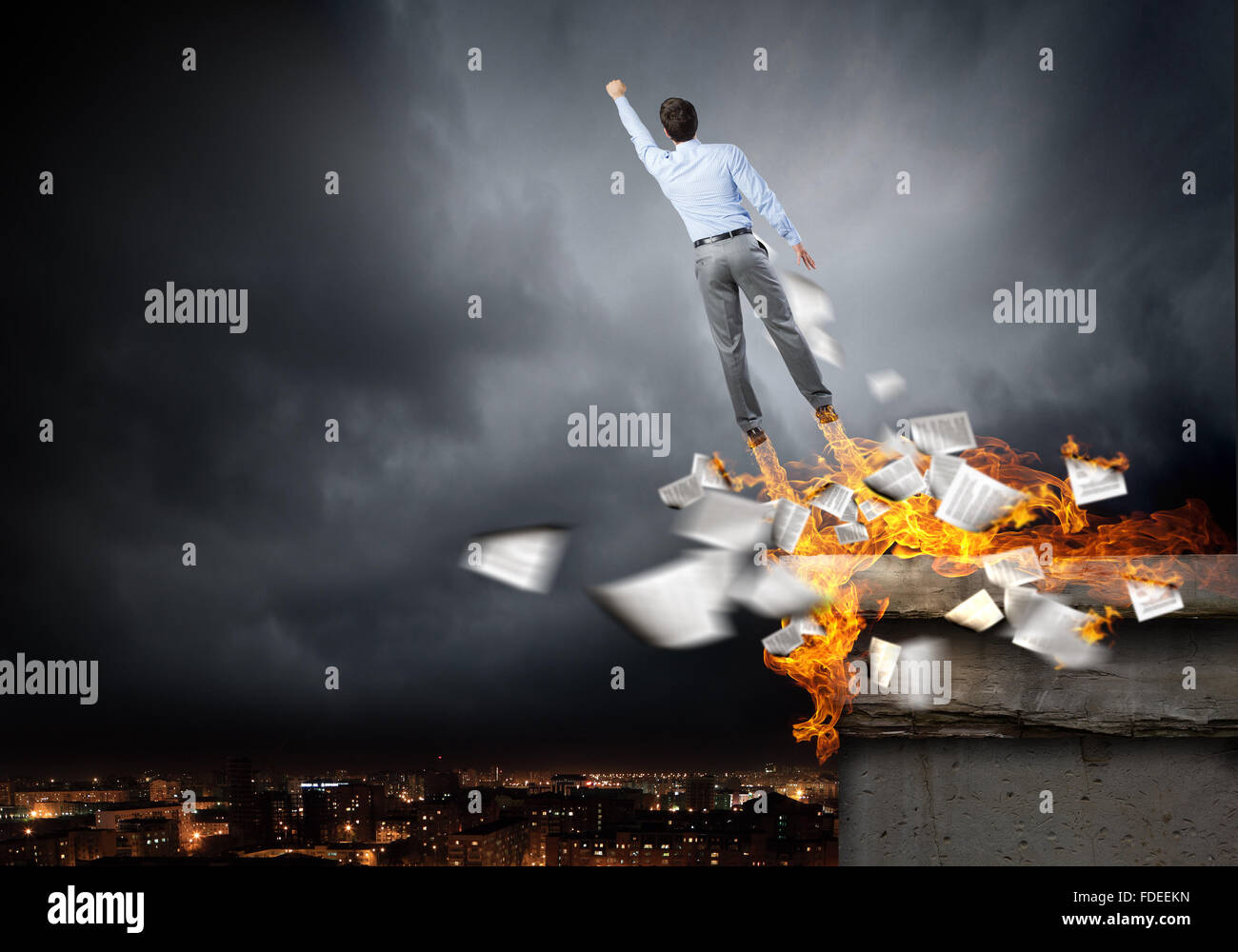 Rear view of businessman superhero flying up in sky Stock Photo - Alamy