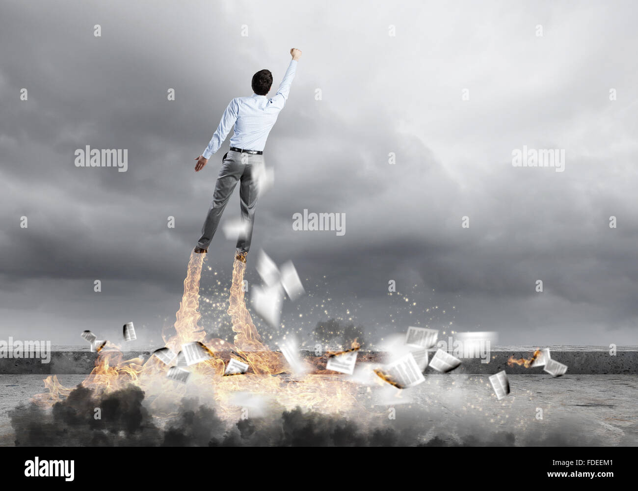 Rear view of businessman superhero flying up in sky Stock Photo - Alamy