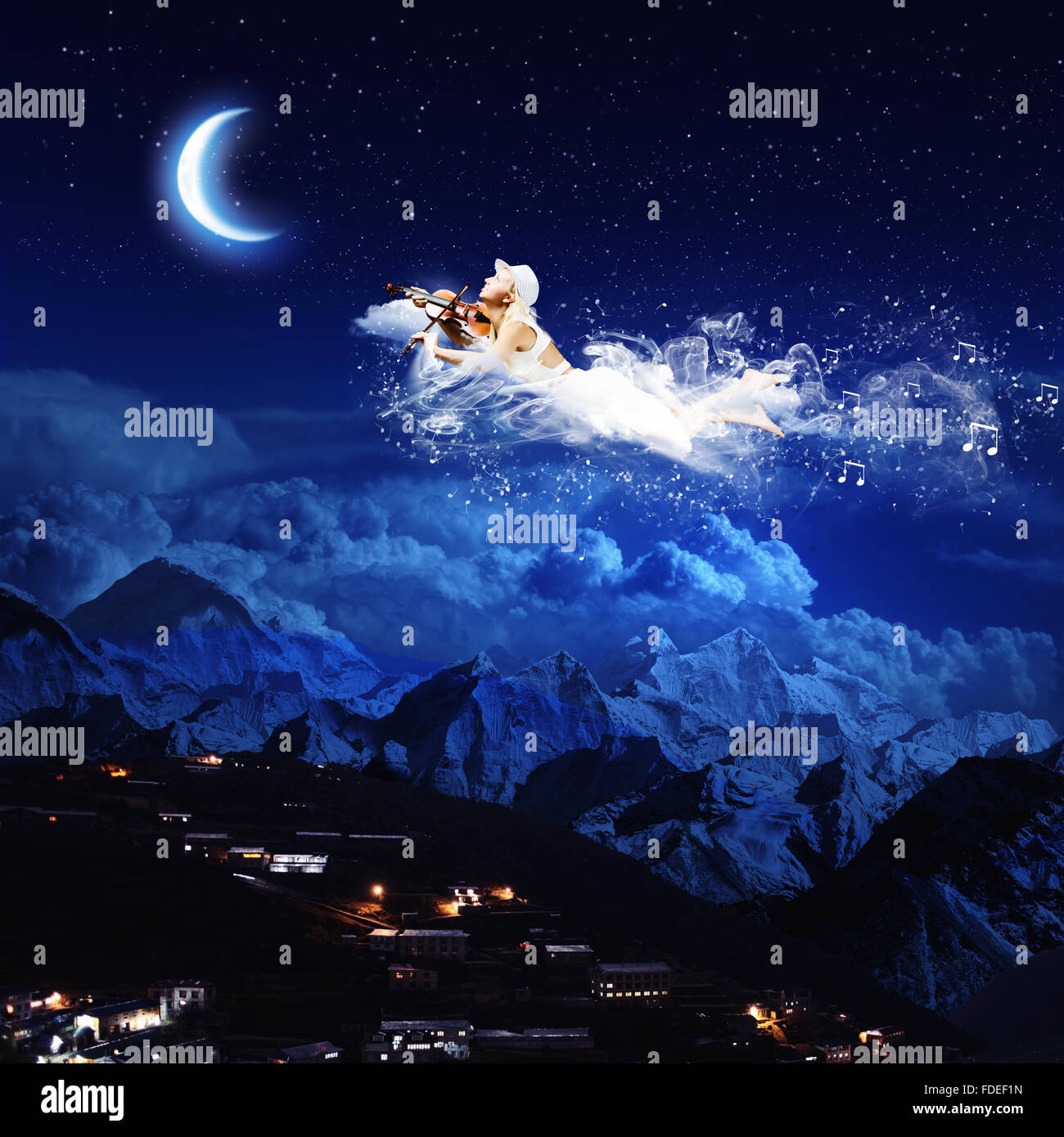 Young blond girl flying in night sky Stock Photo - Alamy