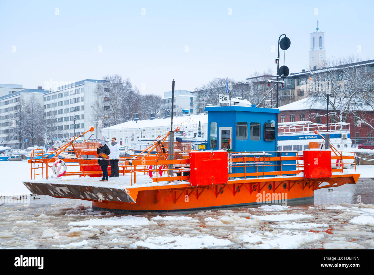 Turku, Finland - January 17, 2016: Ordinary passengers on small city boat Fori, light traffic ferry that has served Aura River Stock Photo