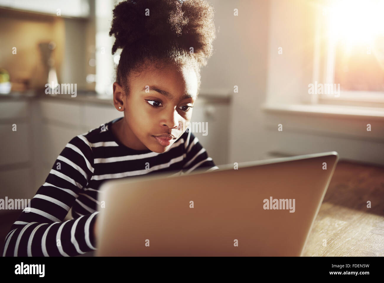 Pretty Black Teen Girl Watching A Movie On Her Laptop Computer