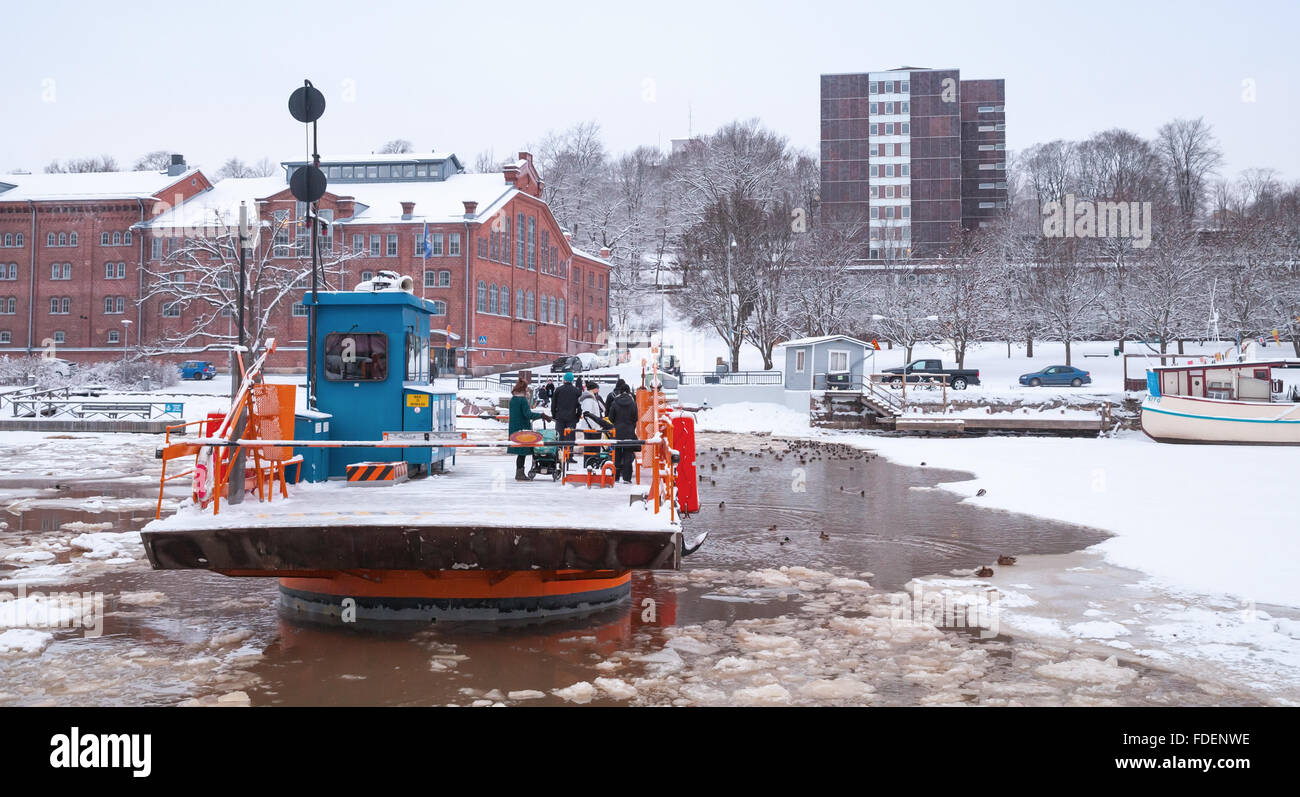 Turku, Finland - January 17, 2016: Ordinary passengers float on city boat Fori, light traffic ferry that has served Aura River Stock Photo