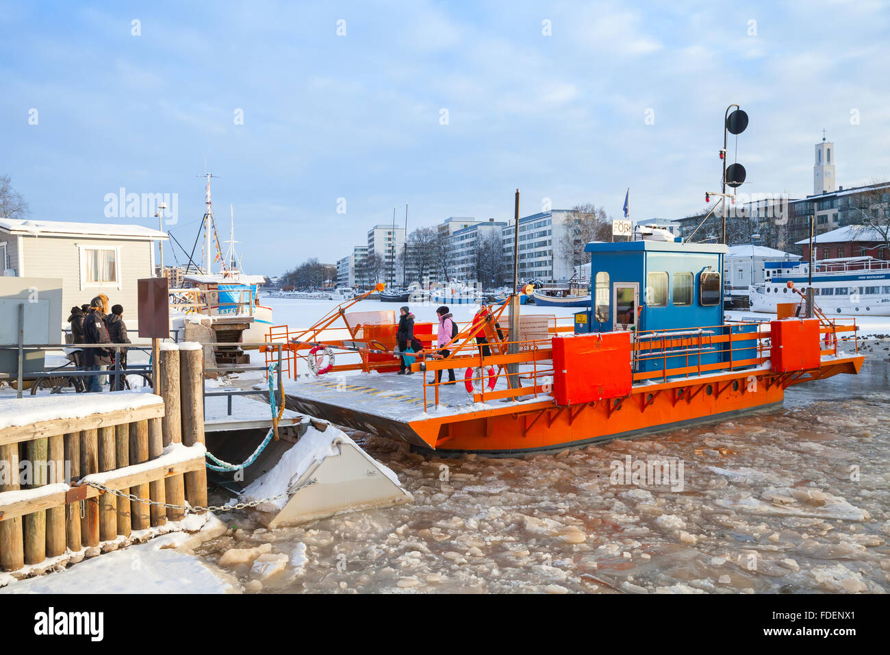 Turku, Finland - January 22, 2016: Ordinary passengers and city boat Fori, light traffic ferry that has served the Aura River Stock Photo