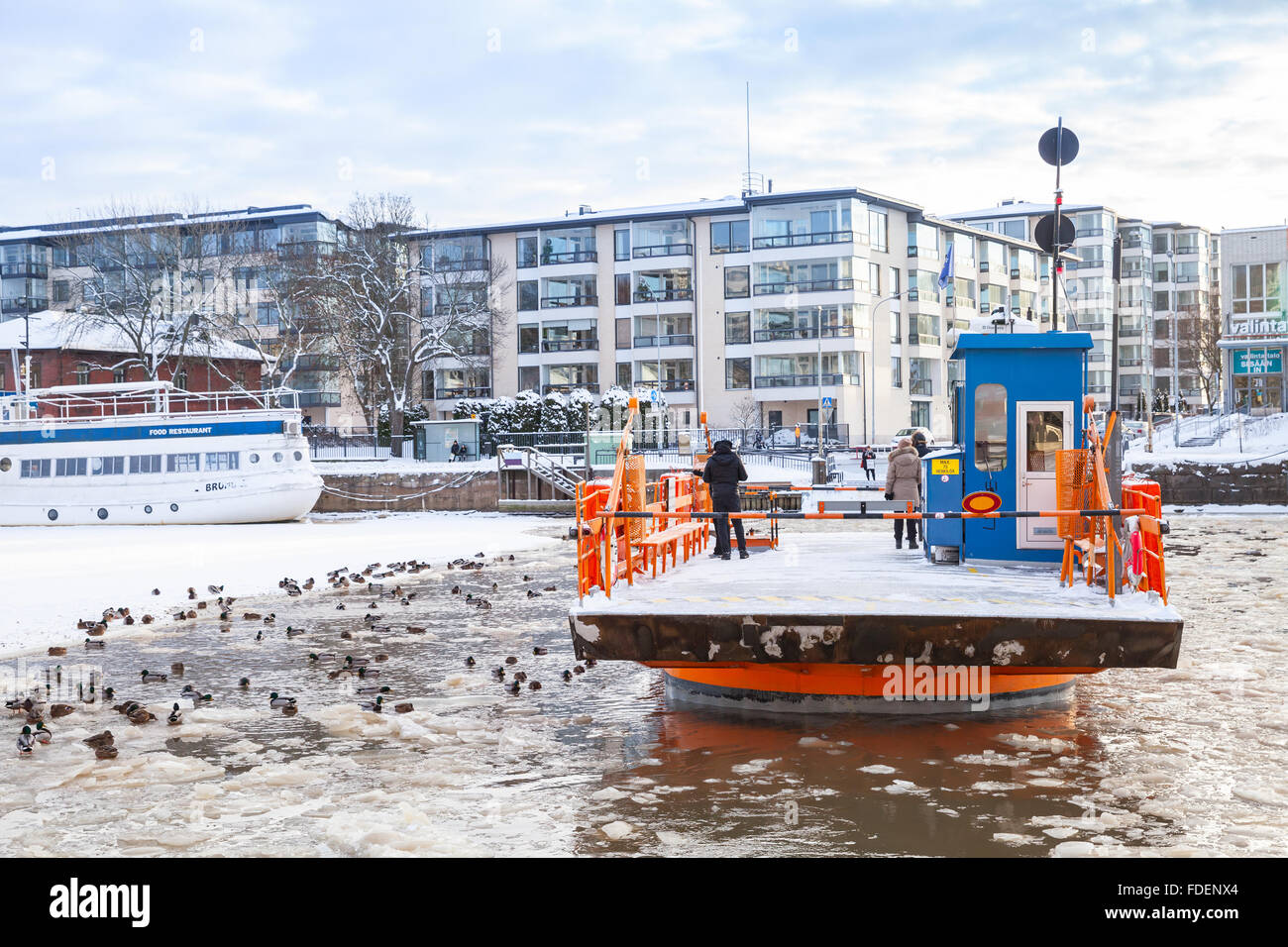 Turku, Finland - January 22, 2016: Ordinary passengers on small city boat Fori. Light traffic ferry that has served Aura River Stock Photo