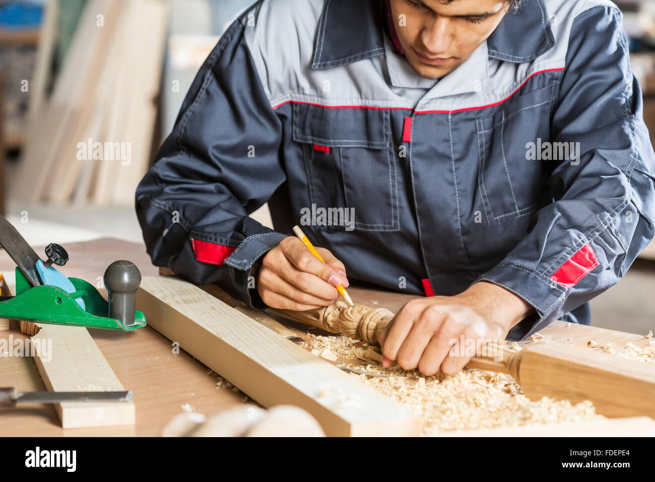 Young carpenter working with cutter in his studio Stock Photo Alamy