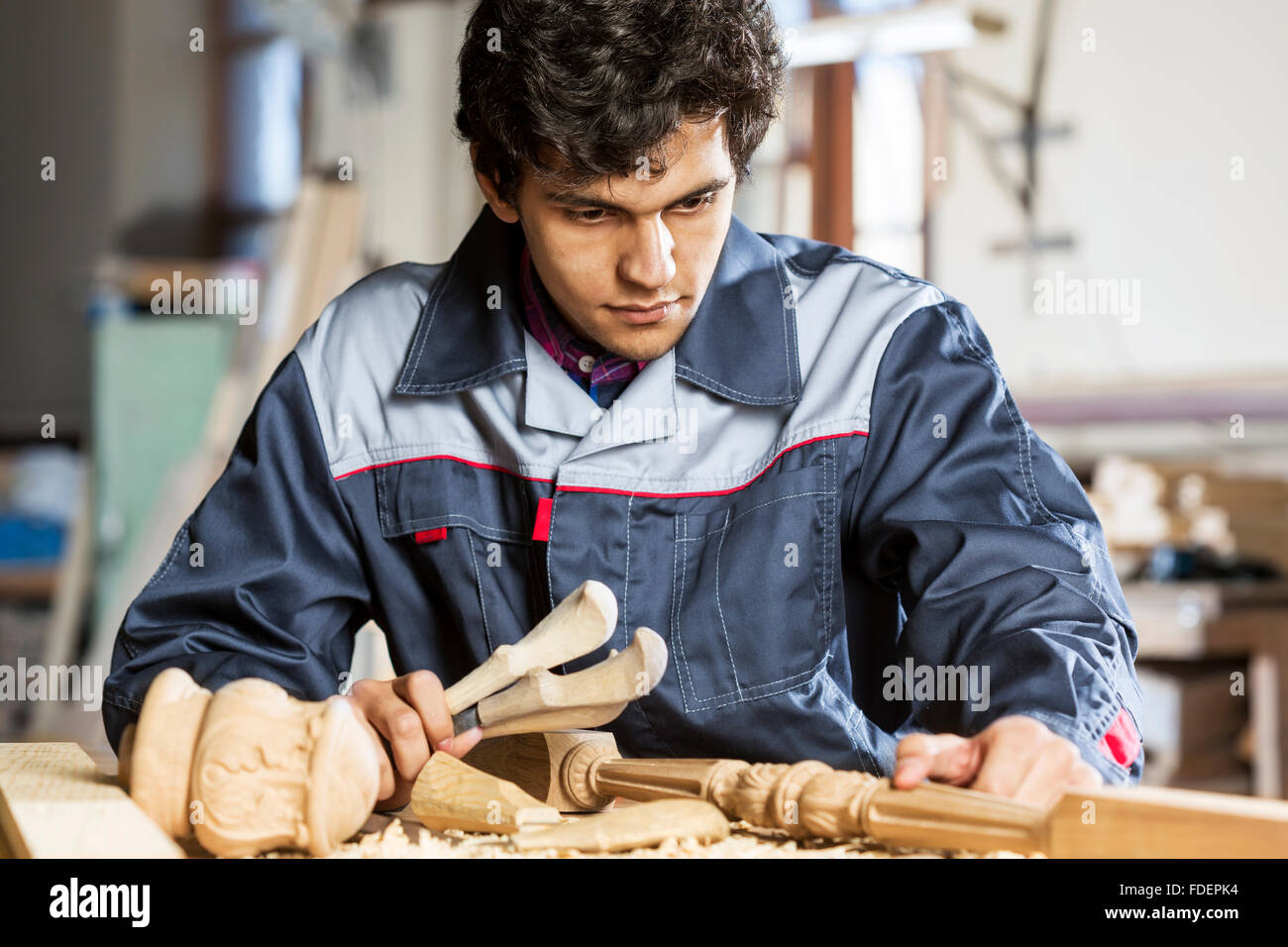 Young carpenter working with cutter in his studio Stock Photo Alamy