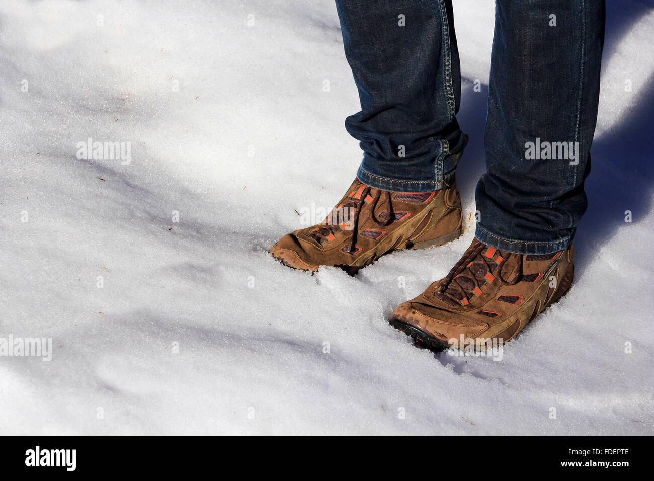 with the walking boots in the snow Stock Photo Alamy