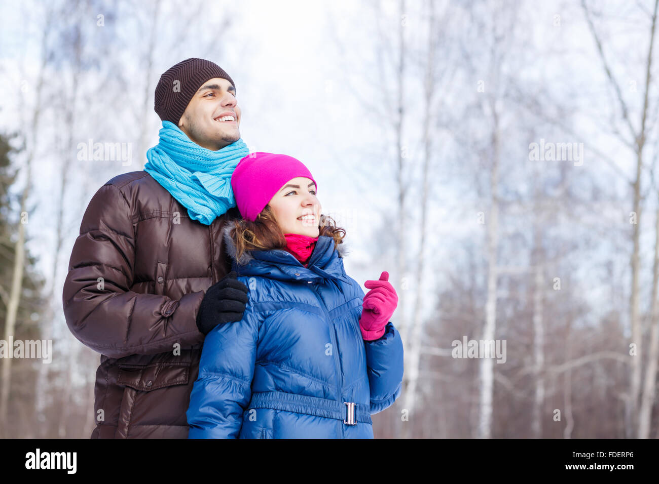 Happy young couple in winter park having fun Stock Photo - Alamy