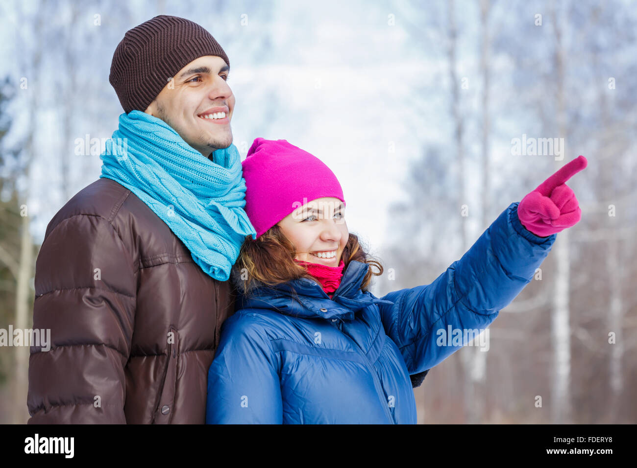 Happy young couple in winter park having fun Stock Photo - Alamy