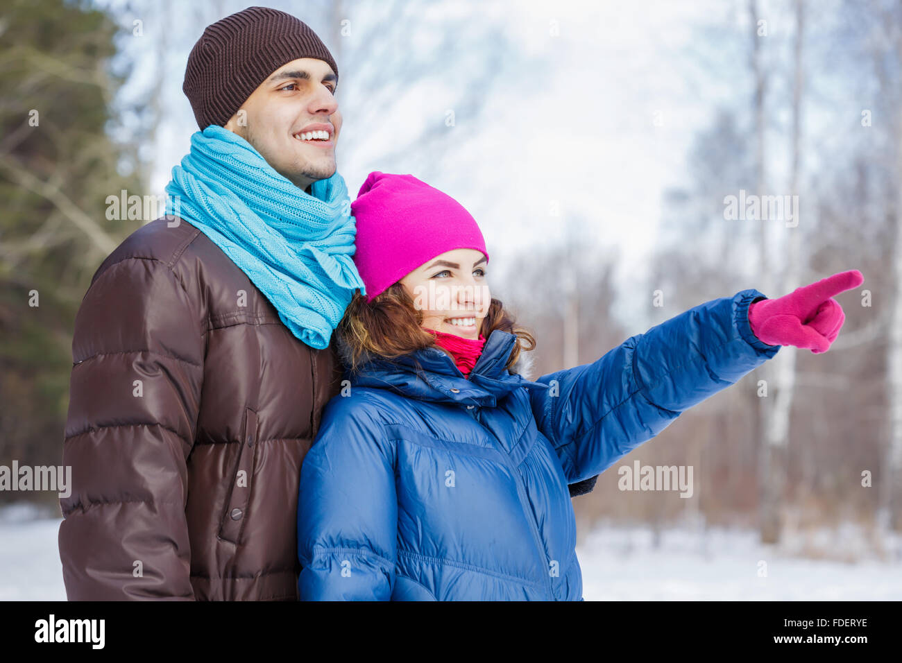 Happy young couple in winter park having fun Stock Photo - Alamy