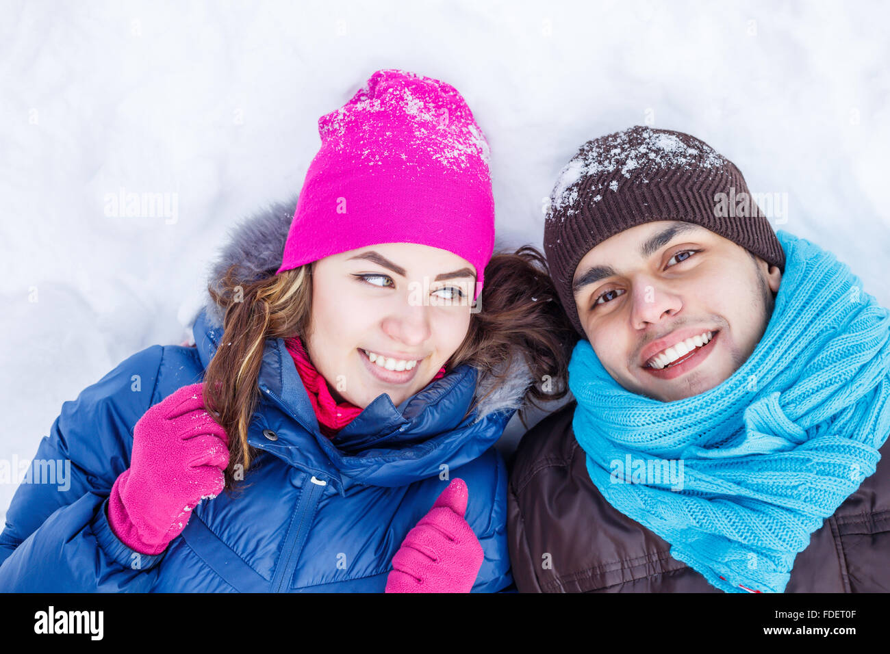 Happy young couple in winter park having fun Stock Photo - Alamy