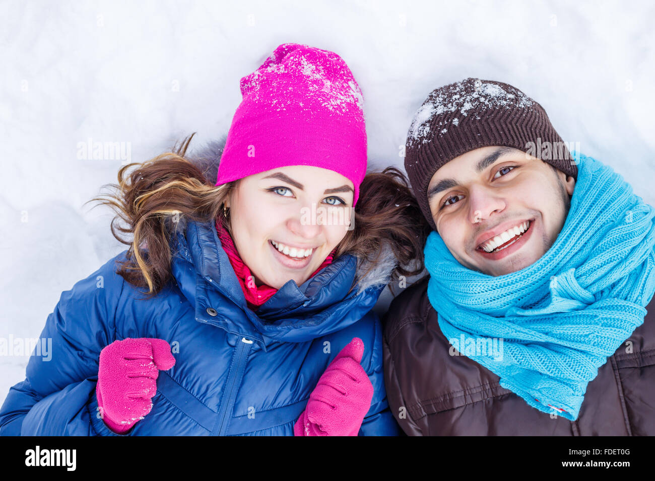 Happy young couple in winter park having fun Stock Photo - Alamy