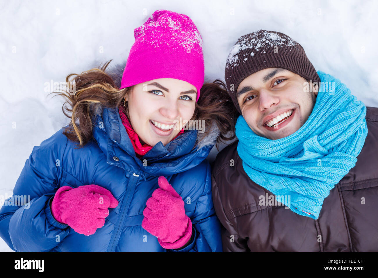 Happy young couple in winter park having fun Stock Photo - Alamy
