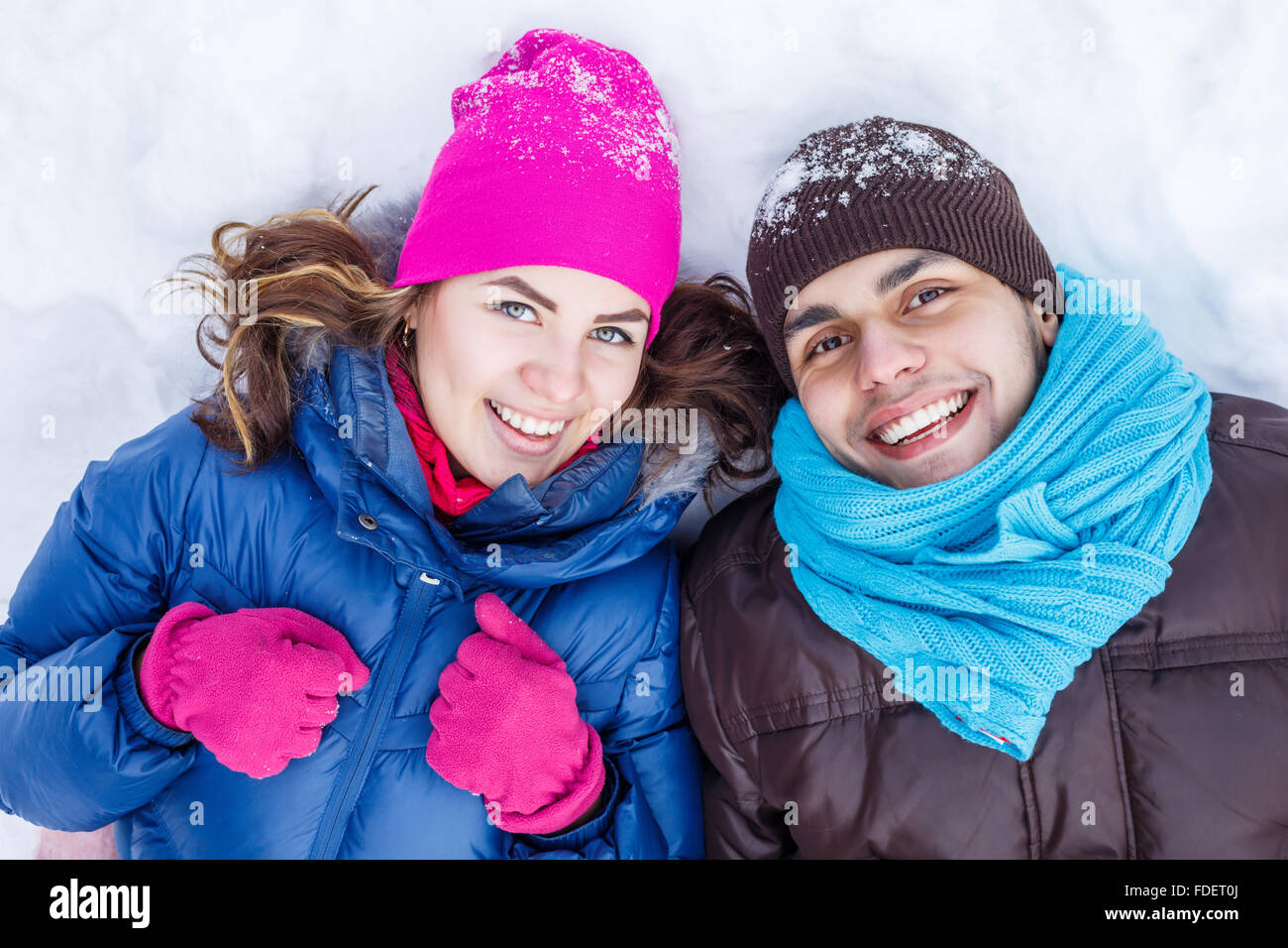 Happy young couple in winter park having fun Stock Photo - Alamy