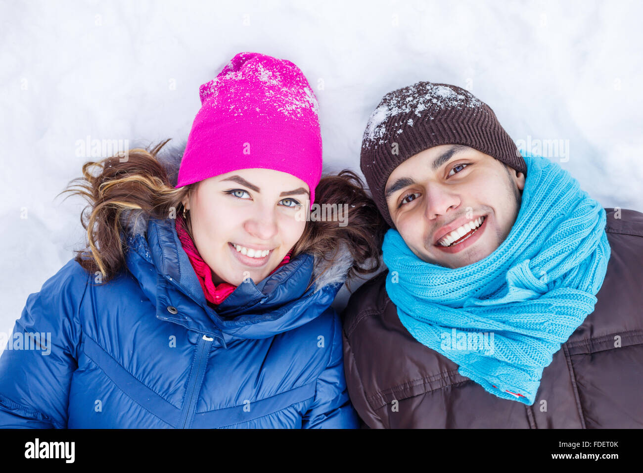 Happy young couple in winter park having fun Stock Photo - Alamy