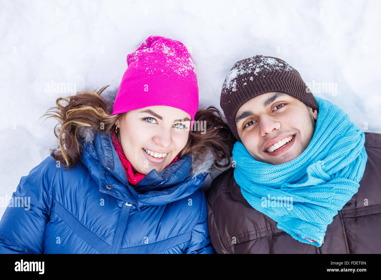 Happy young couple in winter park having fun Stock Photo - Alamy