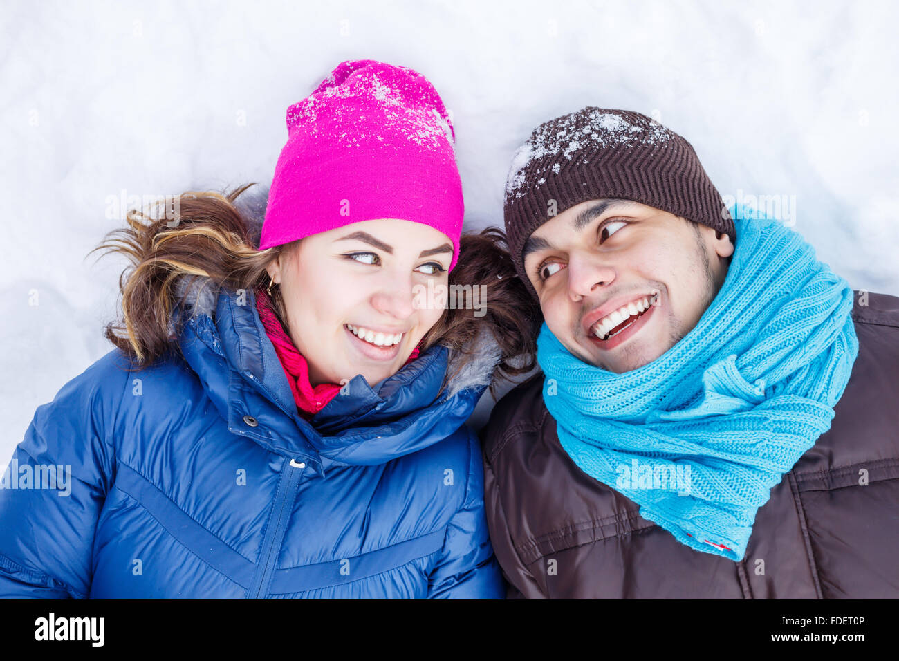 Happy young couple in winter park having fun Stock Photo - Alamy