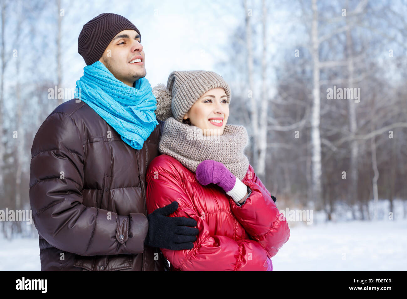 Happy young couple in winter park having fun Stock Photo - Alamy