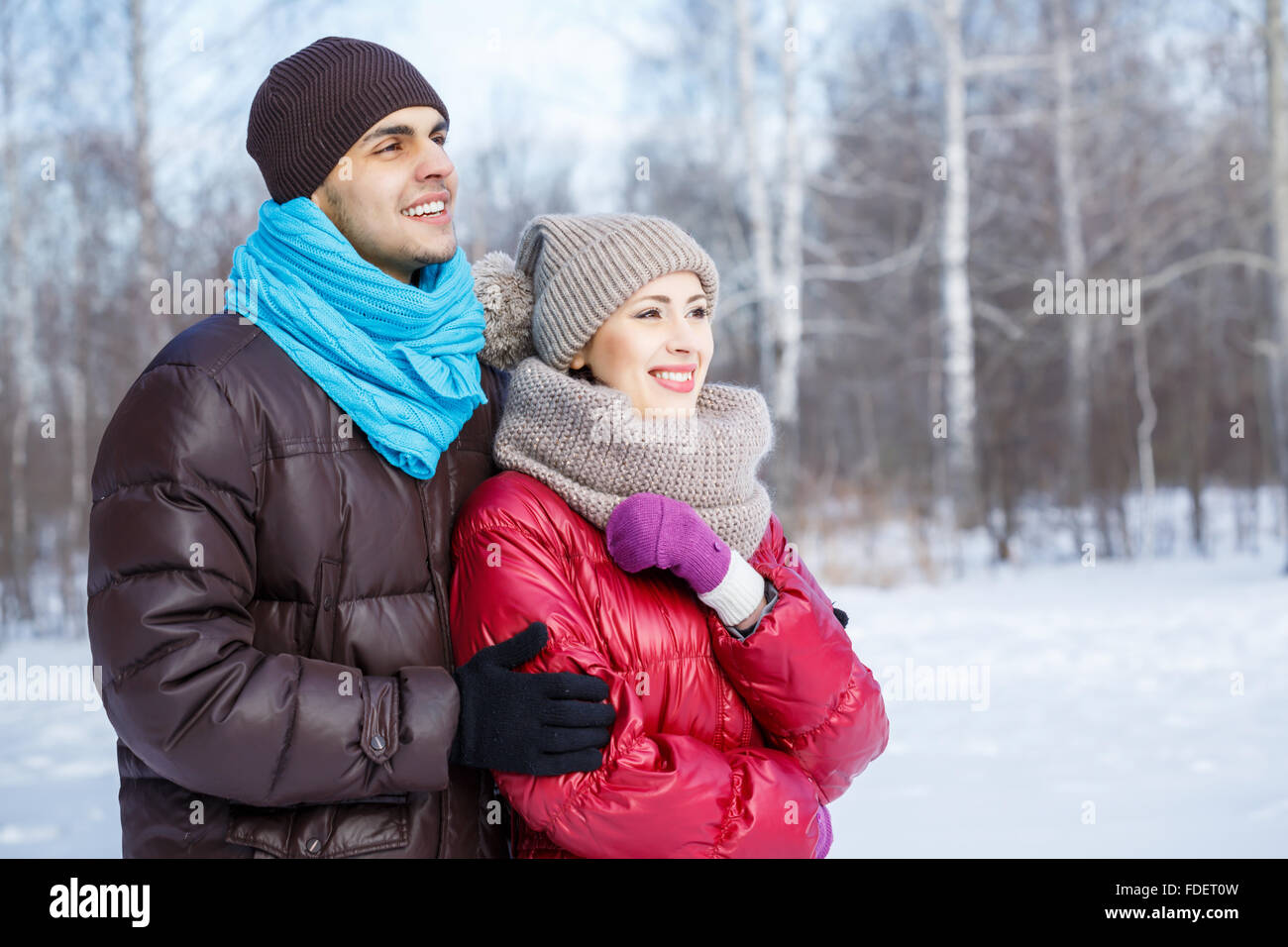 Happy young couple in winter park having fun Stock Photo - Alamy