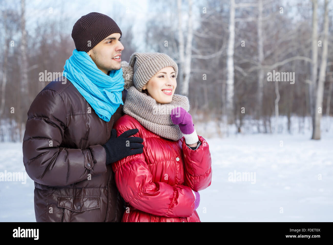 Happy young couple in winter park having fun Stock Photo - Alamy