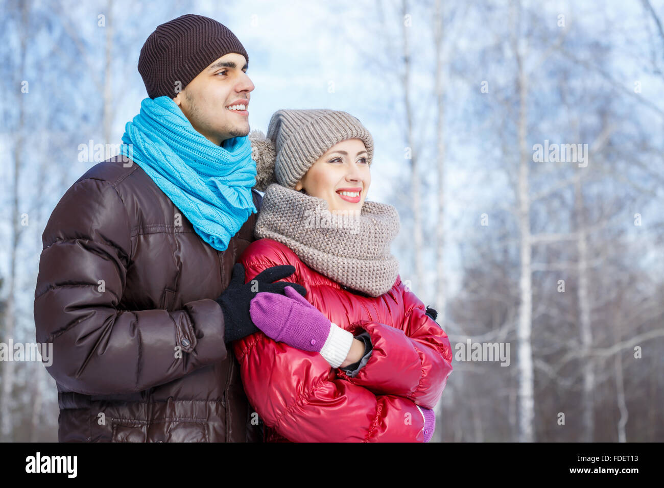 Happy young couple in winter park having fun Stock Photo - Alamy