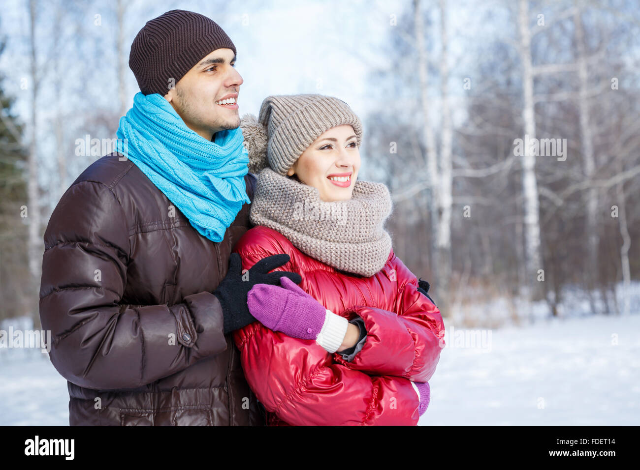 Happy young couple in winter park having fun Stock Photo - Alamy